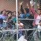Asylum seekers from Central America in a cage constructed underneath a bridge by U.S. Customs and Border Protection on March 27, 2019